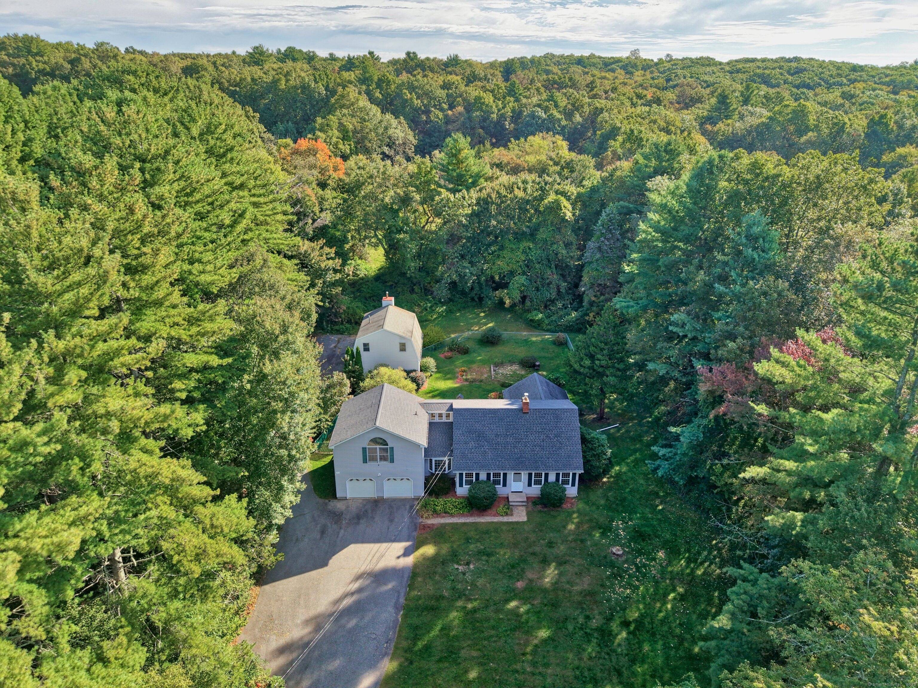 More than meets the eye with this charming cape, tucked away on the desirable end of Wildcat Hill Road !
