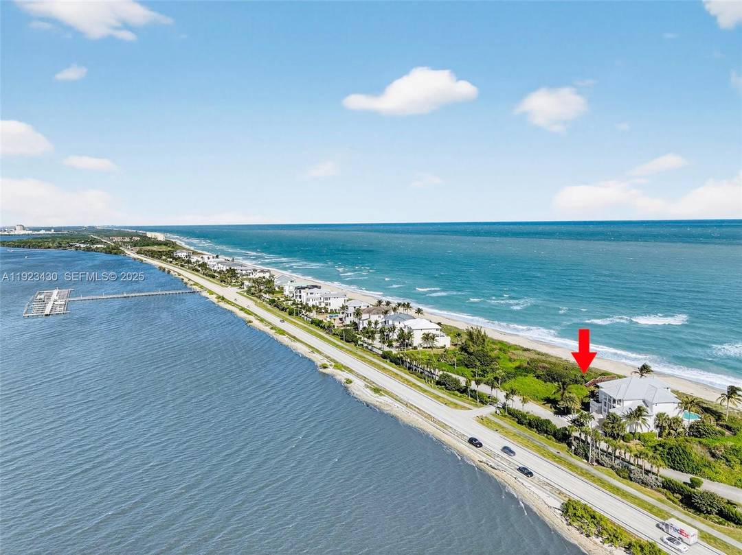 Ocean to riverfront living at its best in the exclusive gated community of Diamond Sands on Hutchinson Island PLUS it comes with two deeded boat slips in the marina.
