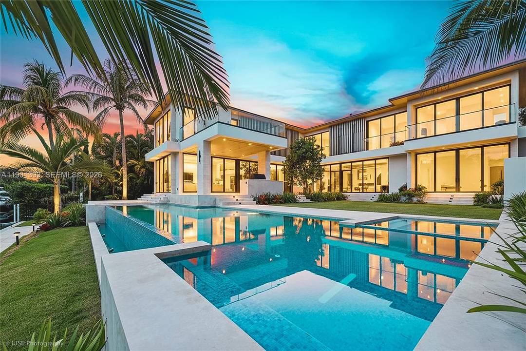 Discover the perfect blend of privacy, security, and modern sophistication in this waterfront estate within Bay Point s exclusive gated enclave.