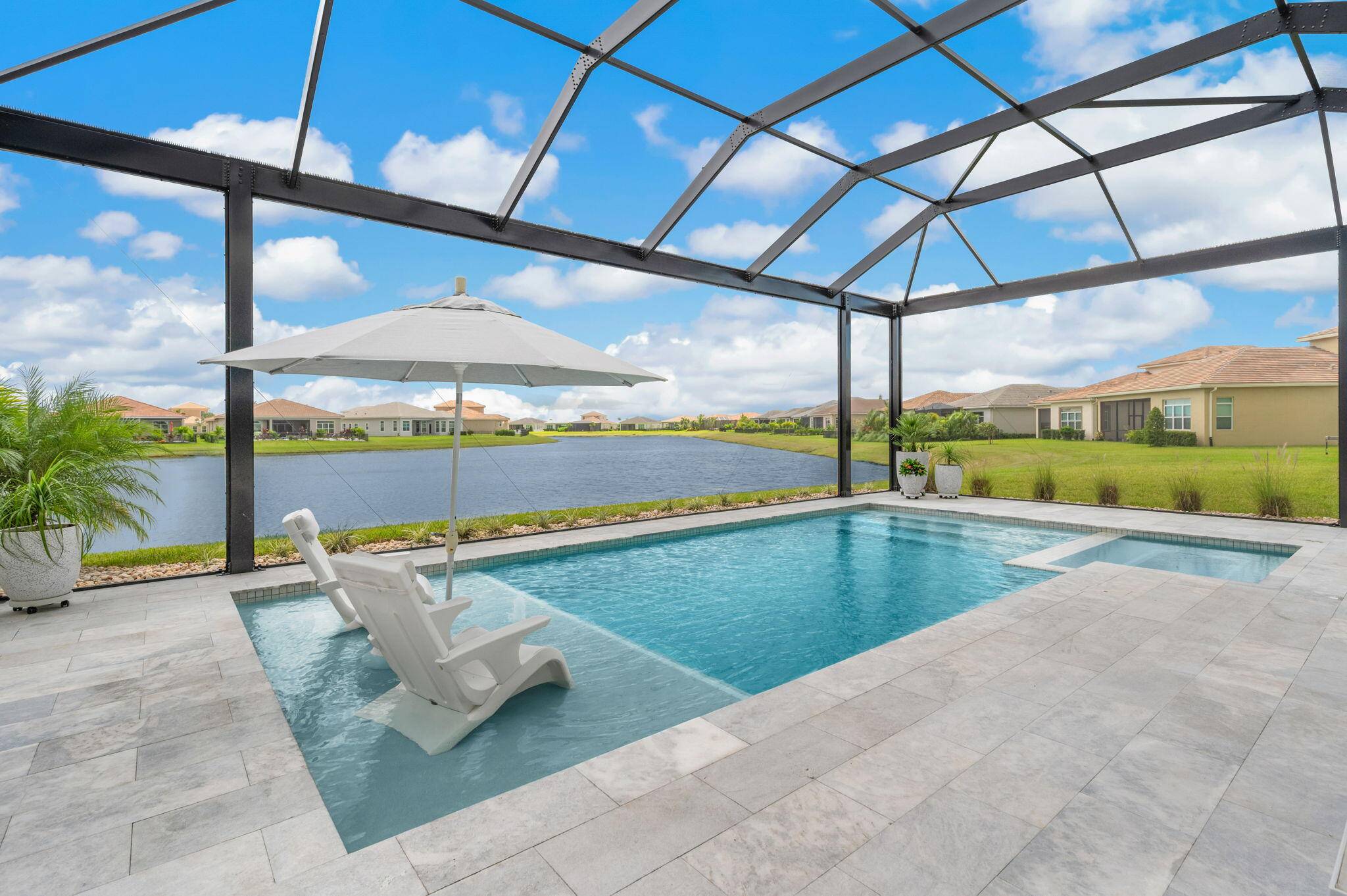 Stunning upgraded Madison model with sweeping lake views in PGA Verano.