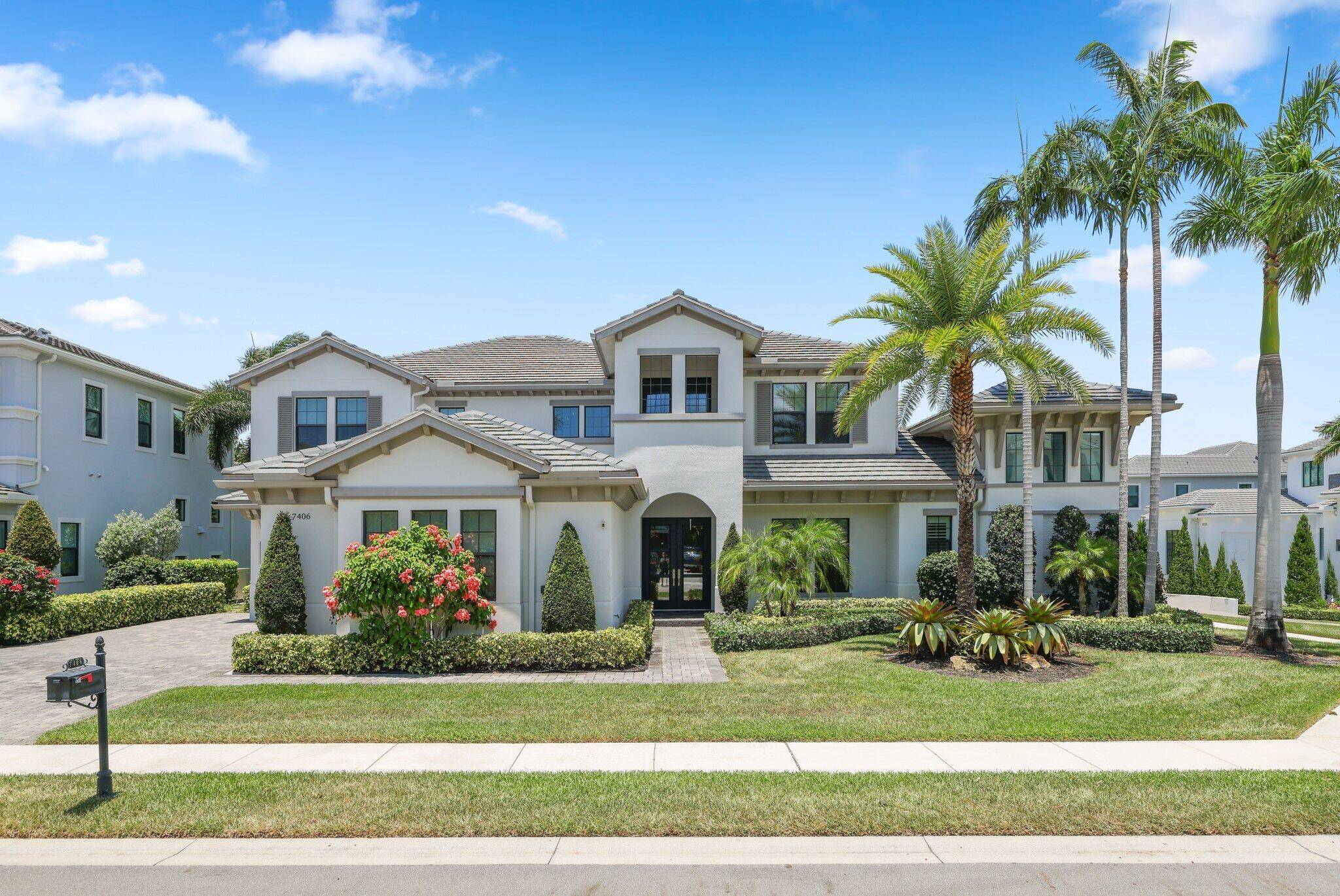 Discover refined living in this custom home located in the Signature Collection of Royal Palm Polo.