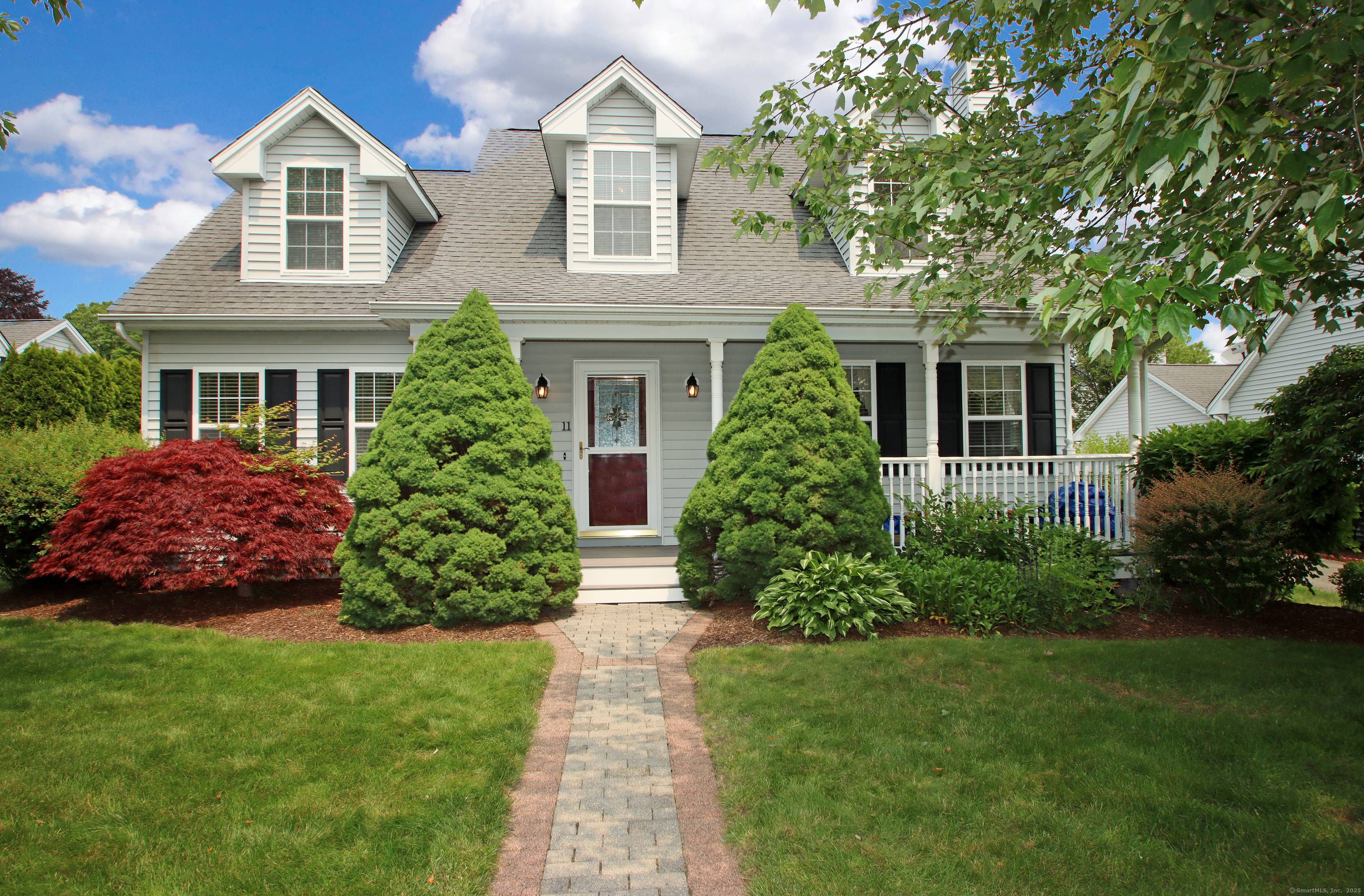 Delightful Cape style condominium situated in a lovely development offers spacious and comfortable living.