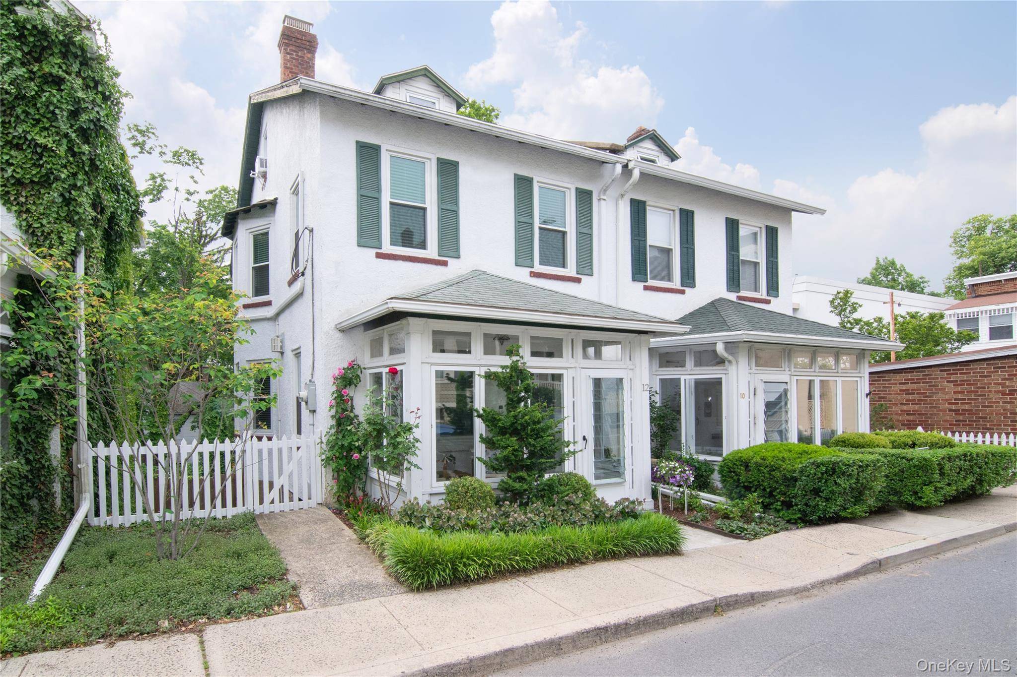 Tucked away in the heart of Irvington, this beautifully updated side hall colonial combines style, convenience, and location with charming front porch, private back yard and detached garage.