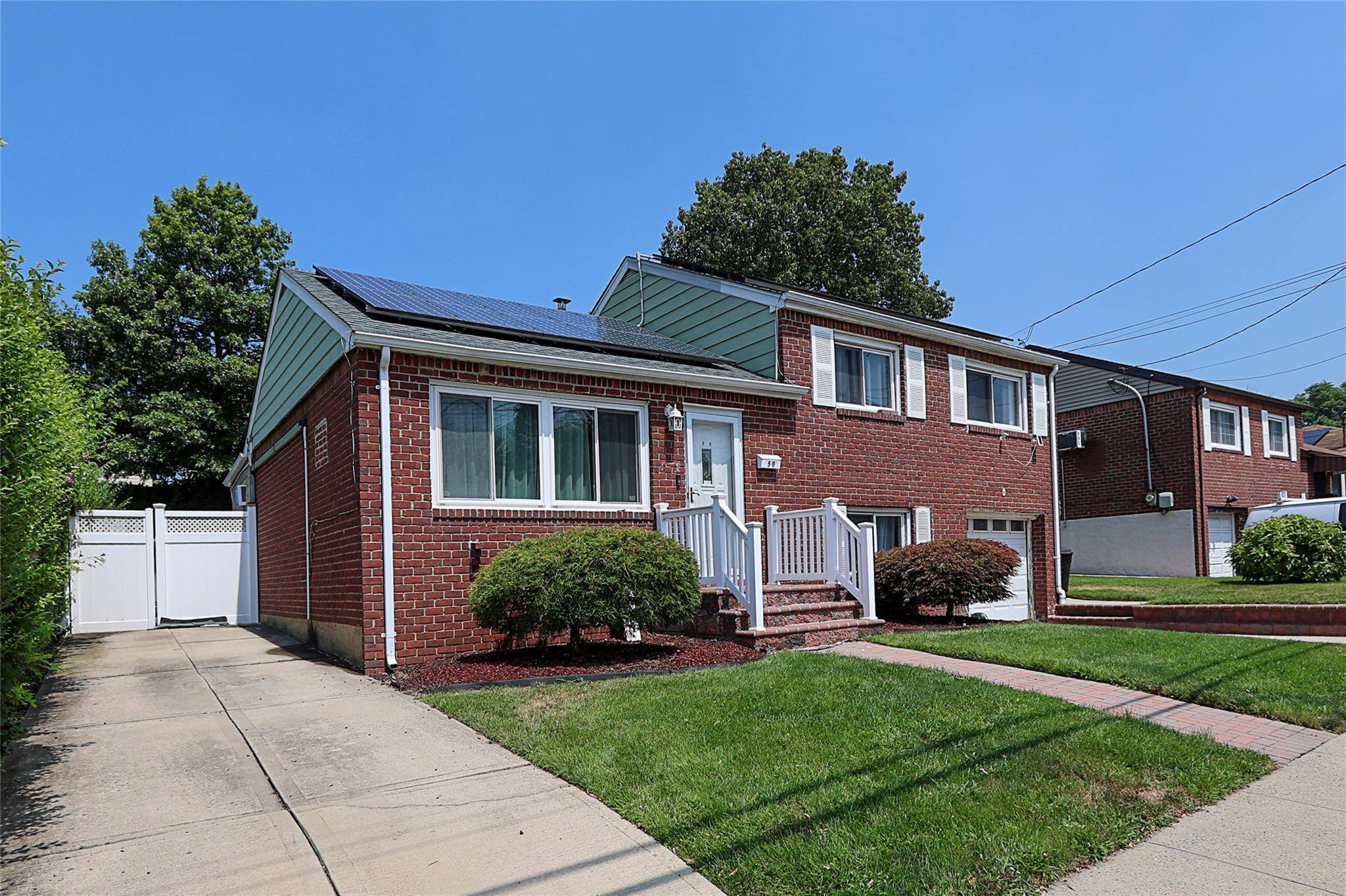 Welcome to this beautifully maintained 3 bedroom, 2 bath split level home, perfectly situated, midblock, on a residential street in South Floral Park.