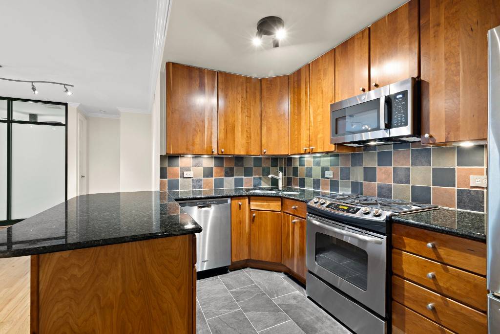 Discover this beautifully maintained 2 bedroom, 2 bath co op residence that perfectly combines contemporary design with practical amenities.