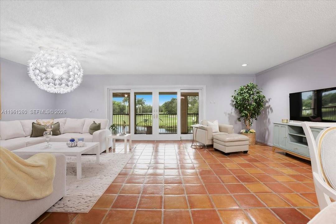 Rare legally combined corner residence in the gated Lago Mar community, offering 4 bedrooms, 3 bathrooms, and approximately 2, 593 sq ft of living space with lake and golf course ...