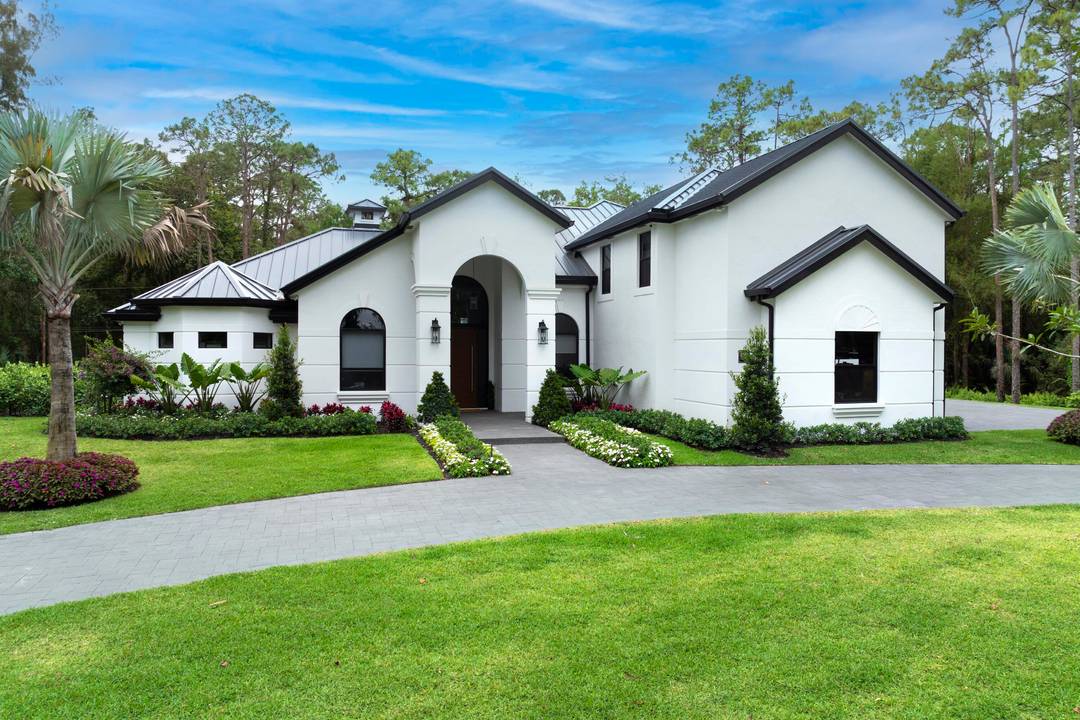 Set on 5 private acres in the heart of Loxahatchee, this stunning estate underwent a complete, top to bottom renovation completed in 2026 and shows like new construction throughout.