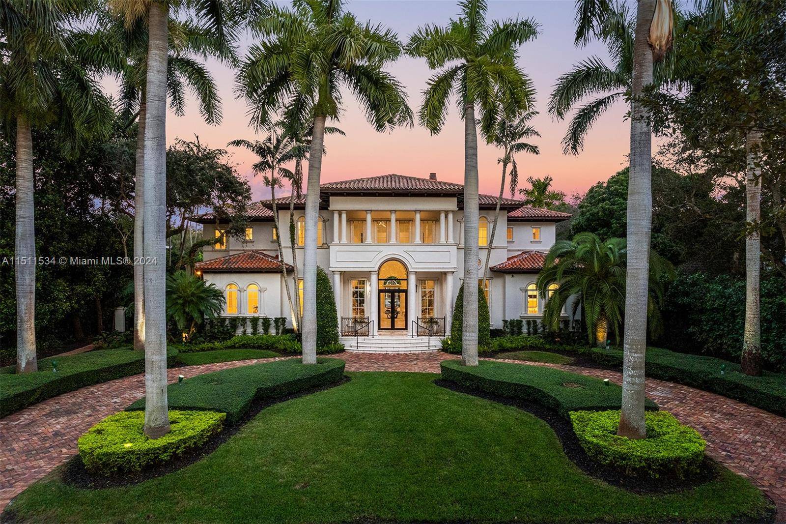 Luxury estate on esteemed Suburban Dr in Pinecrest, boasting a through lot design.