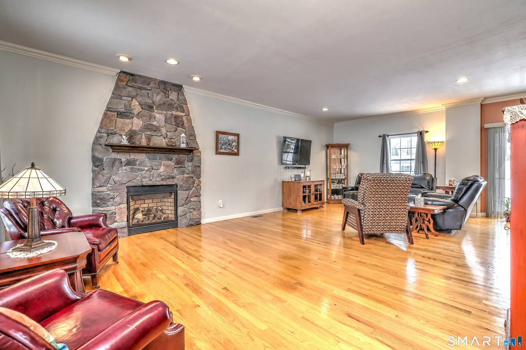 Pride of Ownership Abounds in this meticulous four bedroom colonial nestled on lovely level lot in sought after subdivision with sidewalks and street trees !