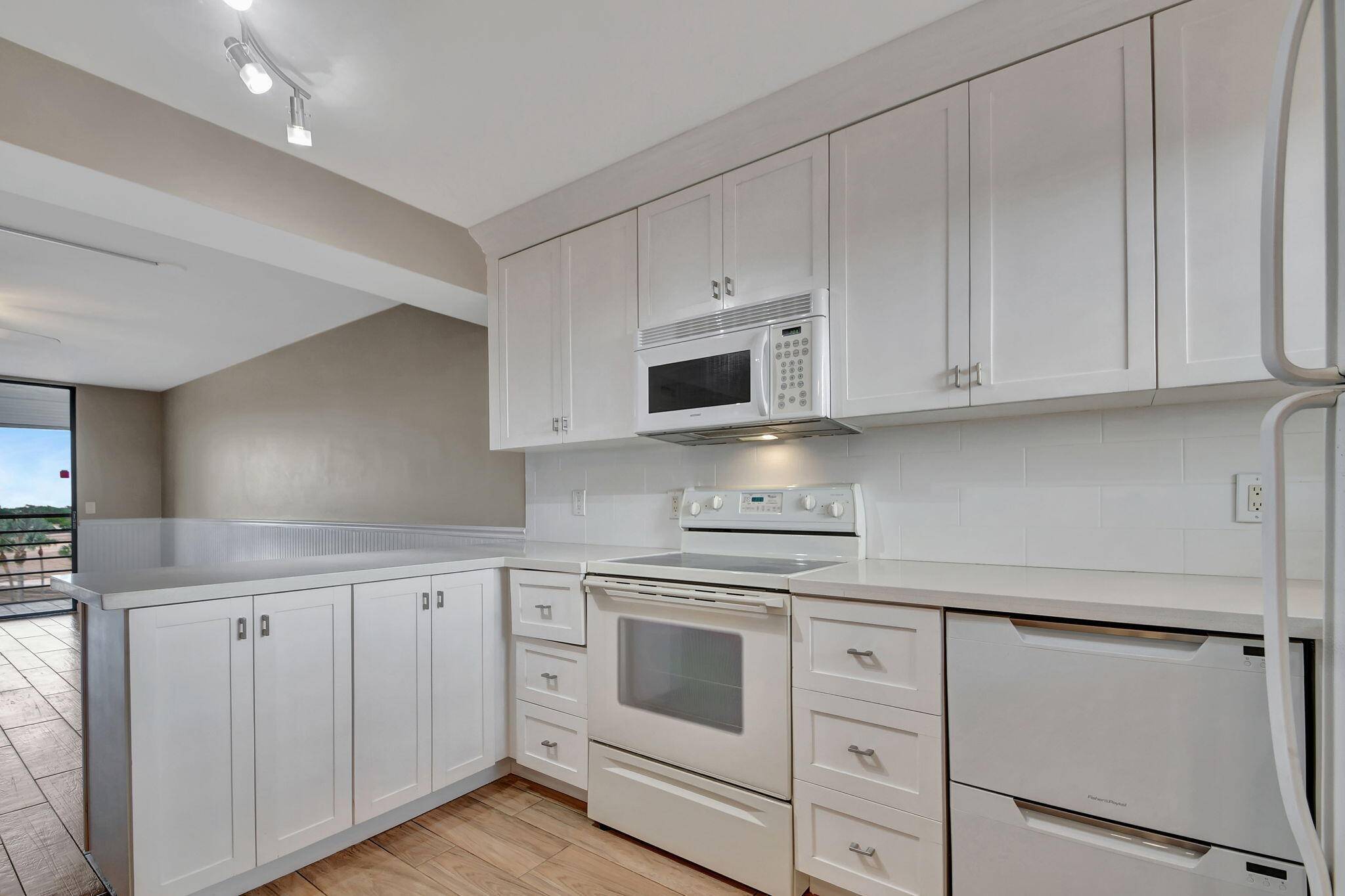 WELCOME TO THIS BEAUTIFUL, PRISTINE UPDATED CONDO WITH BALCONY VIEWS OF THE RESORT STYLE POOL.