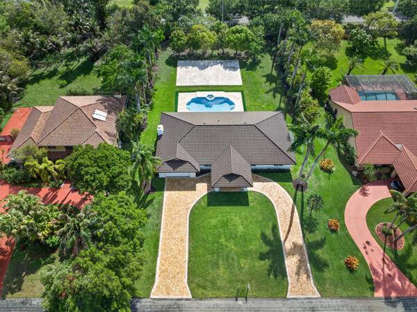 Location Location Location Experience refined living in this stunning 4 bedroom, 3 bath home situated on a one acre lot in Davie.