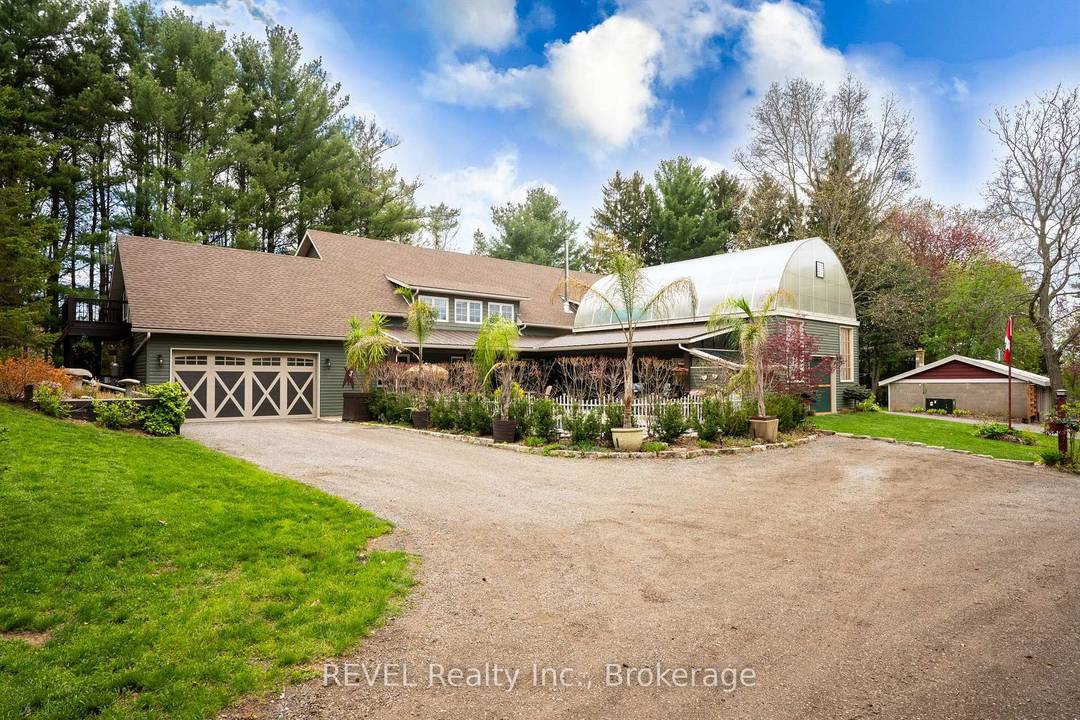 Nestled on a picturesque, treed estate lot in the heart of Pelham's rolling countryside, this exceptional custom built home offers luxury, privacy, and remarkable versatility.