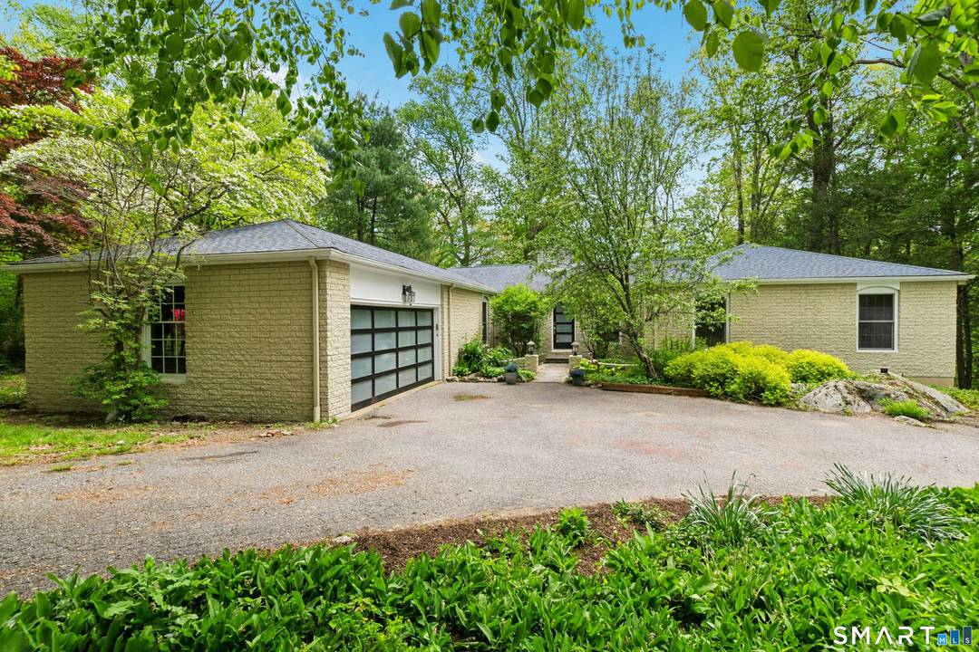Perfectly positioned on a quiet cul de sac in the highly sought after Saw Mill neighborhood, this unique ranch with a contemporary flair and open floor plan offers a seamless ...
