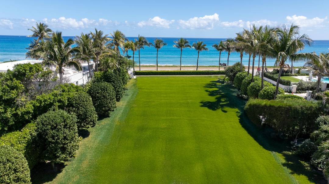 Situated in Palm Beach's prestigious Estate Section, this exceptional oceanfront parcel presents a rare opportunity to build on a unique corner lot with beachfront access on Billionaire's Row.