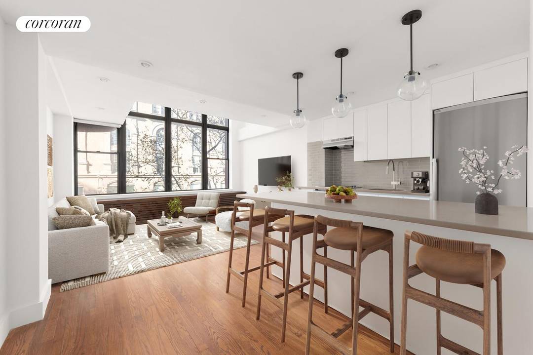 Welcome to a rare duplex one bedroom offering 17 foot ceilings, soaring windows, contemporary finishes, and a uniquely spacious layout in one of downtown's most vibrant locations.