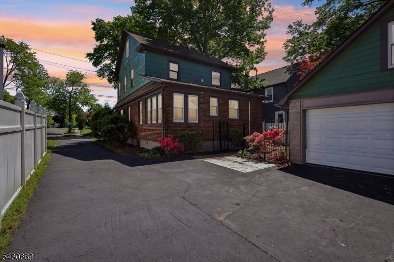 Beautifully updated Tudor style home located in desirable Roselle Park offering the perfect blend of modern updates, functional space, and commuter convenience.