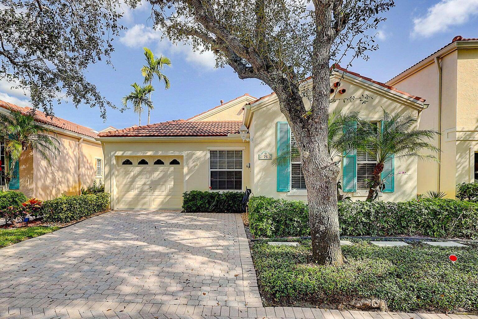 Gorgeous single story home located in the charming community of Villa D'Este in PGA National.