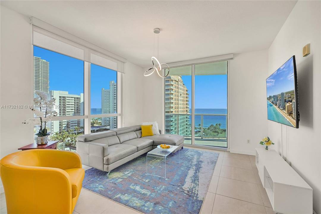 Step into a world of luxury and unparalleled beauty in this stunning 2 2 corner unit, just steps from the beach.
