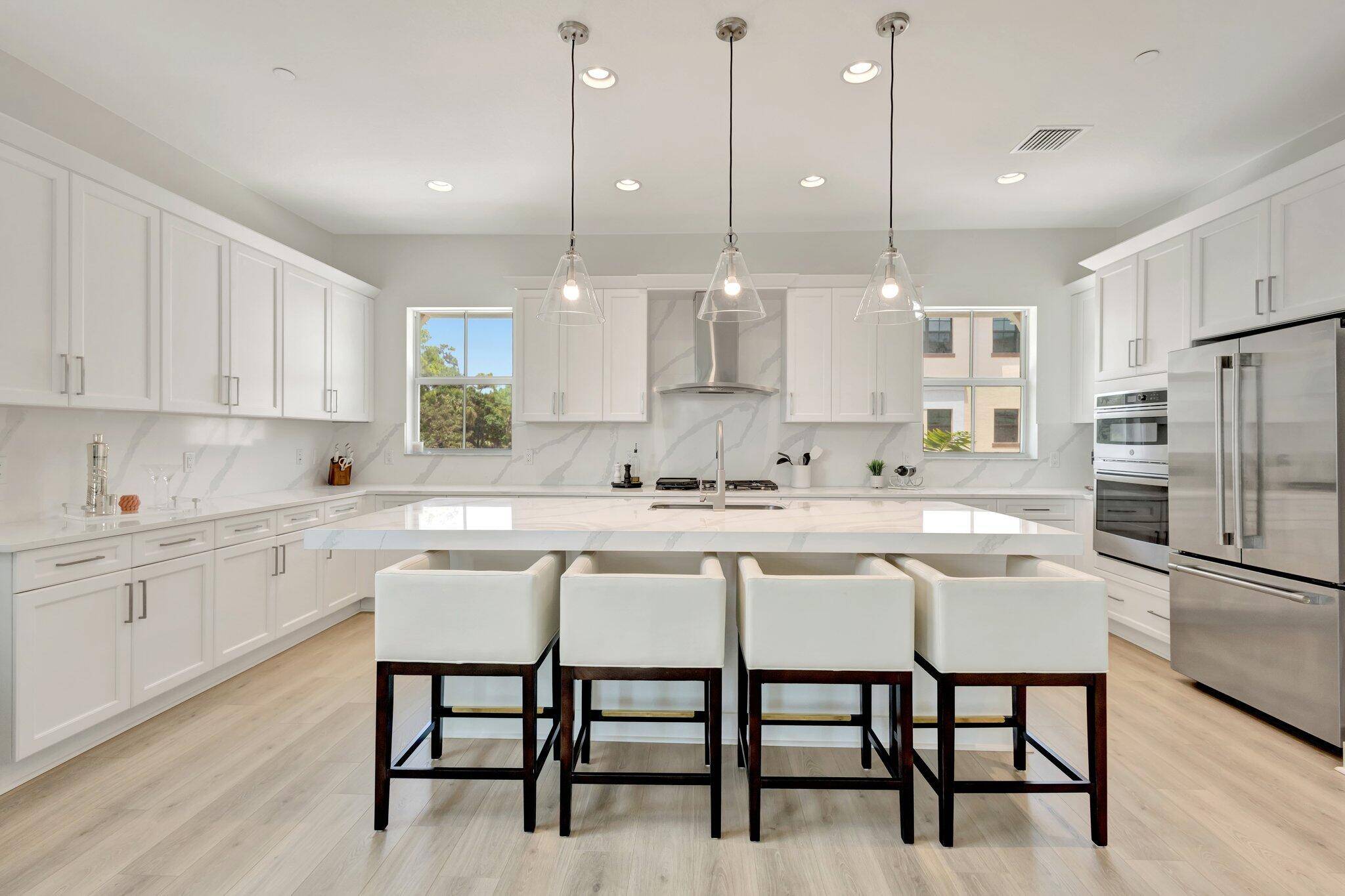 Stunning 2024 corner unit townhouse in Alton boasts an expanded gourmet kitchen with large island and gas stove, oversized private balcony with unobstructed views, and stylish upgrades throughout.