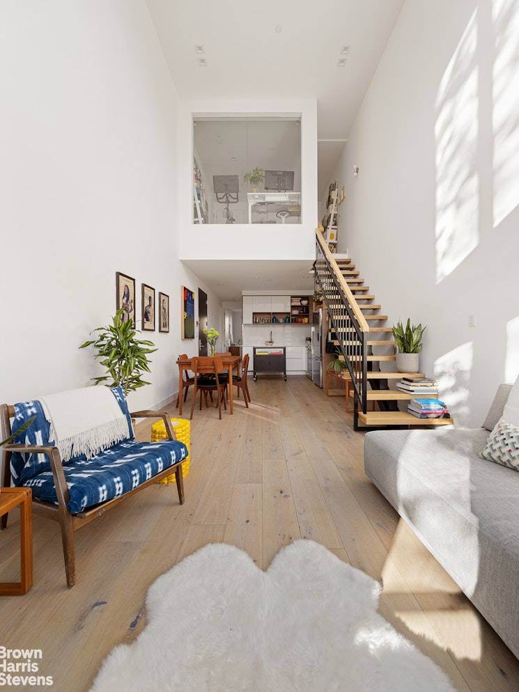 Welcome home to this infinitely bright duplex with floor to ceiling windows, wide plank oak floors, two full bathrooms, and southern and northern exposures both with private balconies.