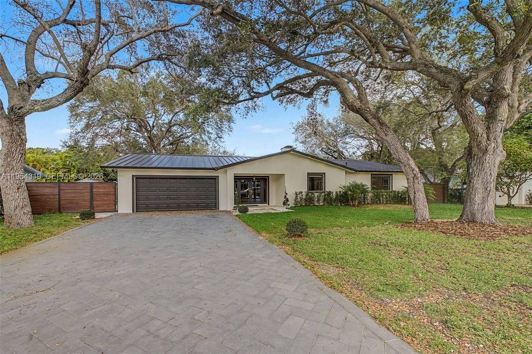 Beautiful, newly renovated 4 bdrm 3 bath home nestled on a charming oak tree lined street in Palmetto Bay.