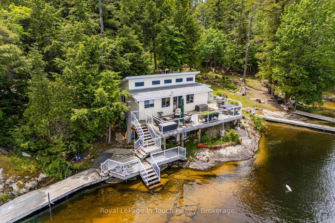 Welcome to 4 Island 270 on stunning Six Mile Lake, a private island retreat with over 400 feet of clean, natural waterfront and some of the most breathtaking north facing ...