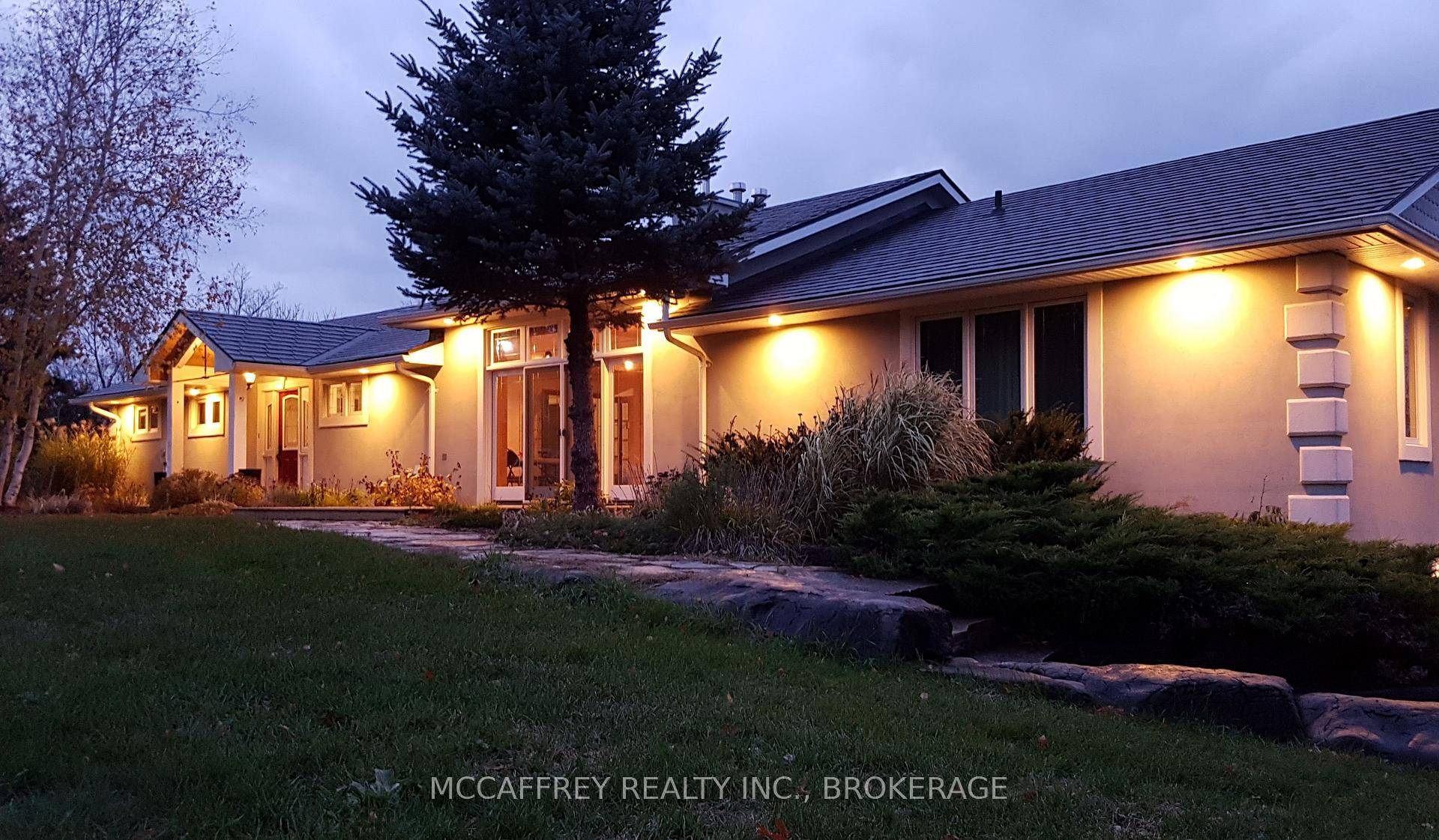 WATERFRONT ESTATE ON 25 ACRES FEATURING THE MAGNIFICENT FOREST MILLS FALLS AND HISTORIC WATER POWERED SAWMILL.