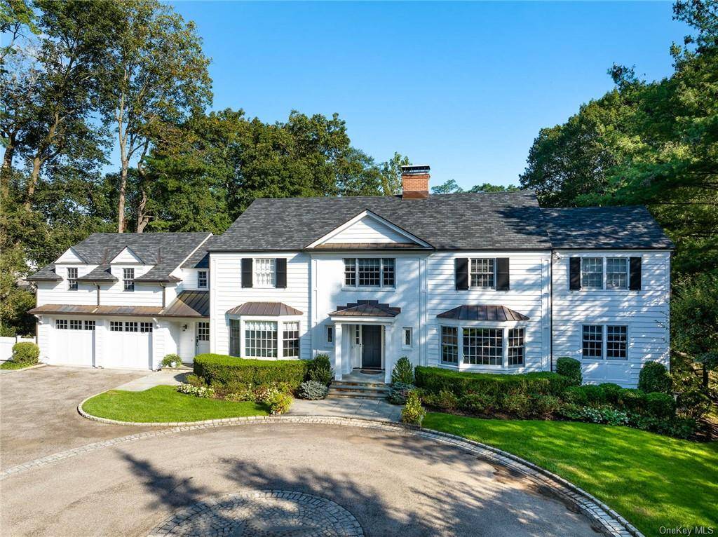 Timeless elegance meets modern luxury in this Colonial masterpiece on 1.