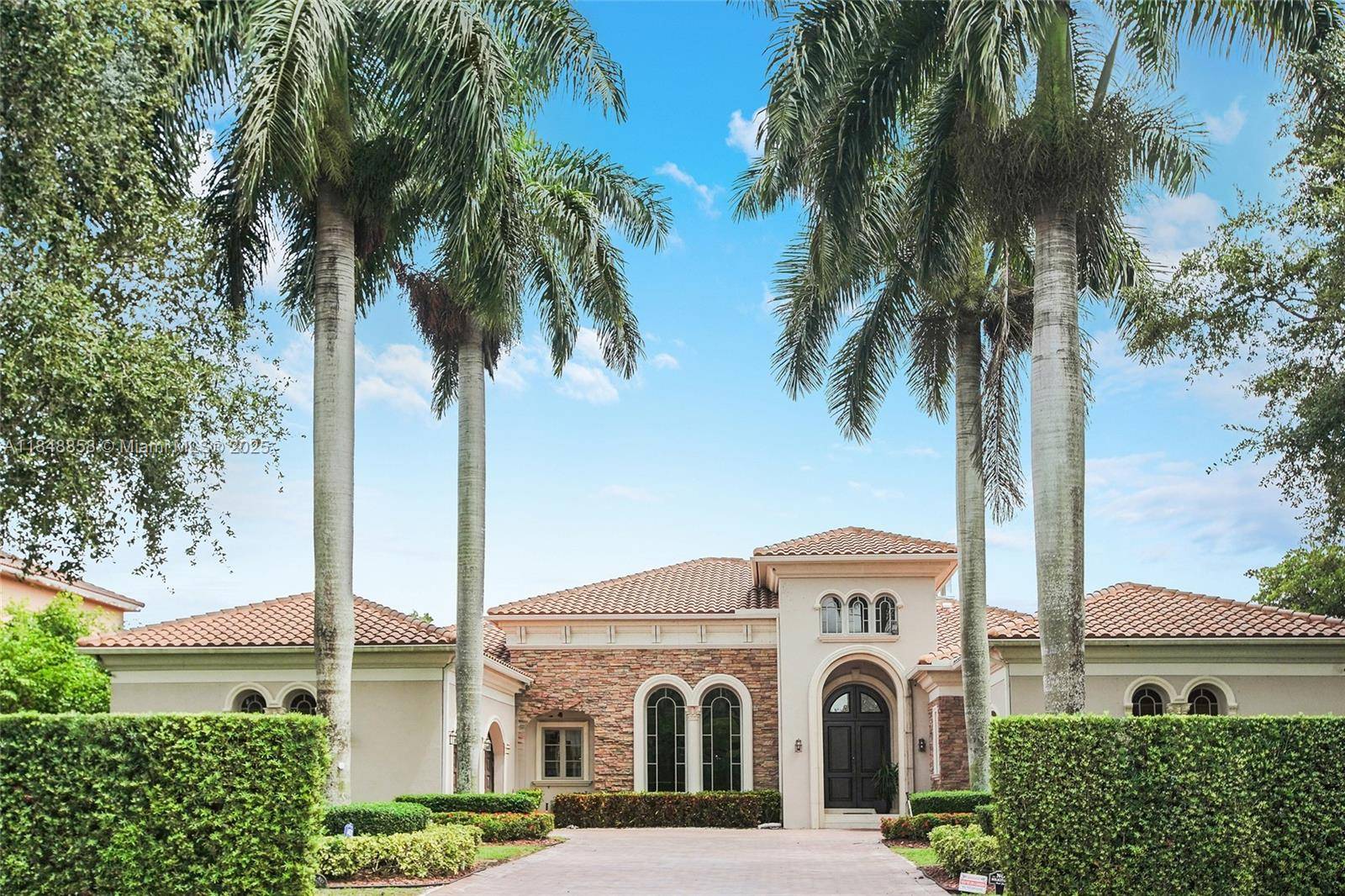 Exquisite Estate in Prestigious Saddle Club Estates.