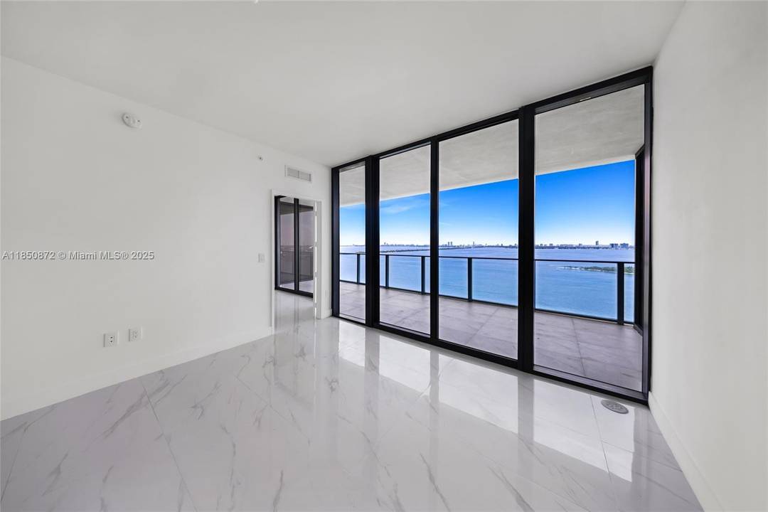 Exceptional 2BD den 3BA residence with private elevator entry, floor to ceiling glass, and beautiful Biscayne Bay views.