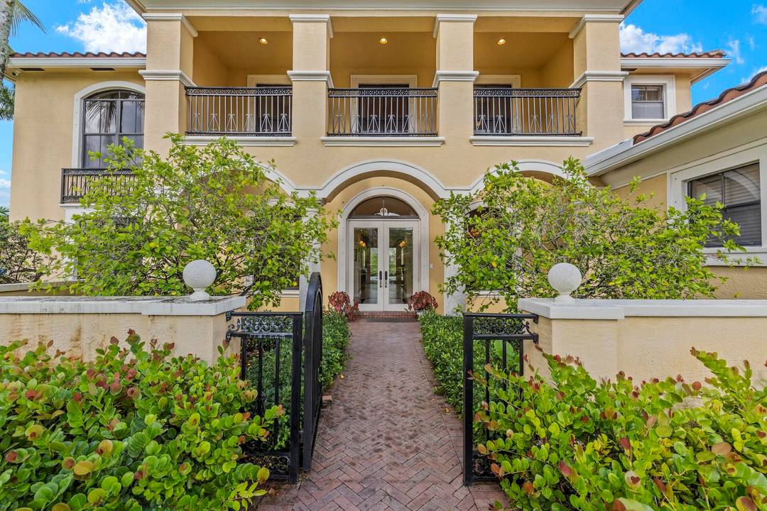 Discover unparalleled luxury in this fully furnished seasonal lakefront estate within the prestigious Isles at Wellington.