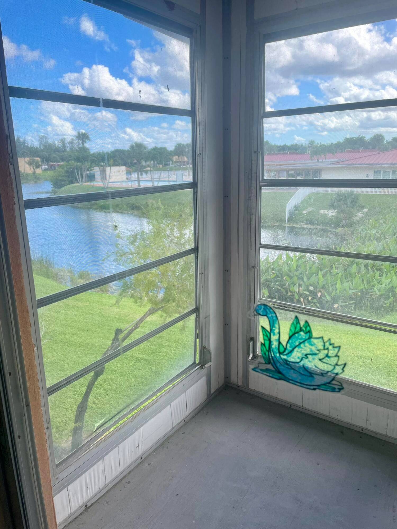 Bright, sun filled corner unit in sought after Golden Lakes Village offers serene water and pool views from your screened in balcony.