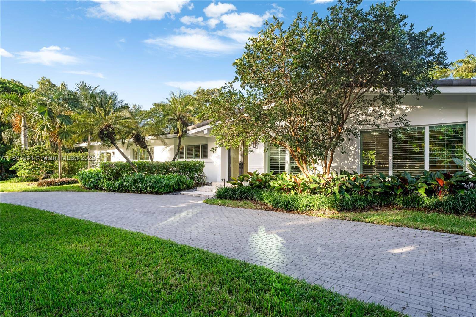 Welcome to this charming and elegant home nestled on a builder s acre in one of Pinecrest s most desirable neighborhoods.