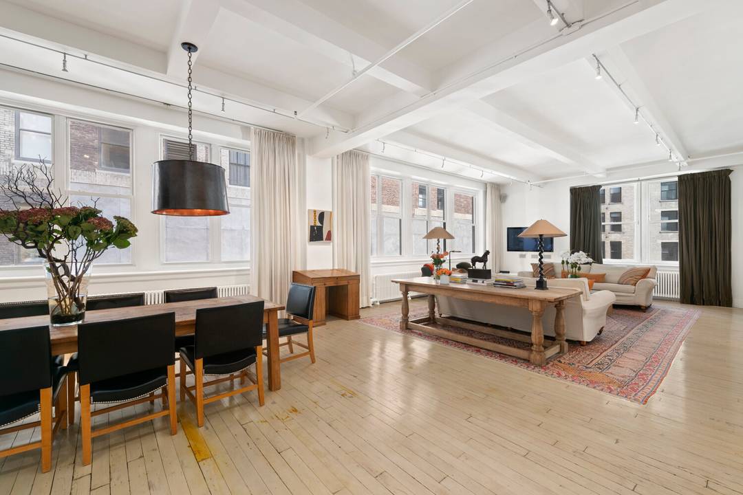 Residence 6R at The Holtz House offers 2, 305 square feet of authentic Flatiron loft living with soaring 11 foot beamed ceilings, oversized windows, and triple exposures to the east, ...