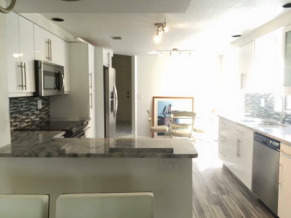 Beautifully renovated SEASONAL rental townhouse in desirable Boca Pointe country club.