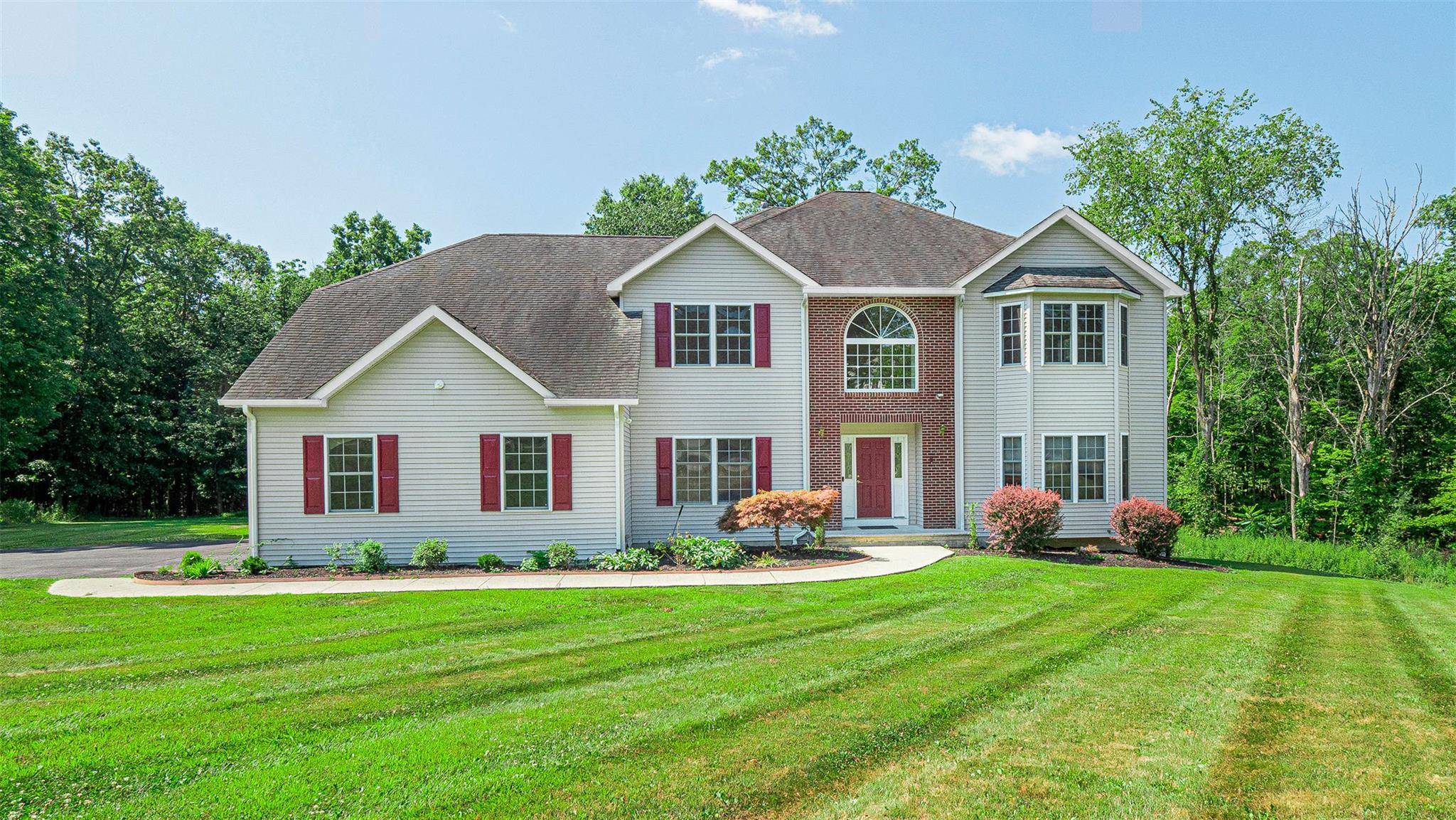 Welcome to this Magnificent Custom Colonial perfectly situated on a quiet cul de sac in the sought after historic Town of Goshen, NY.