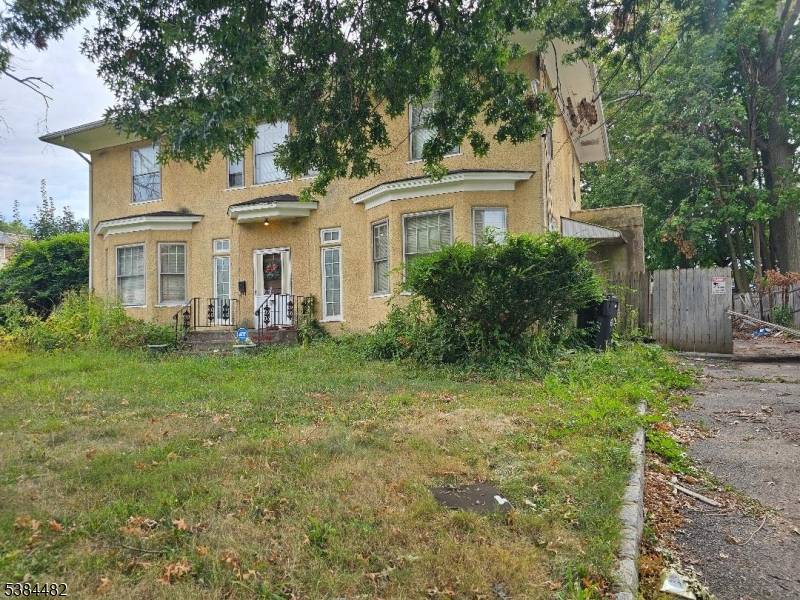 Your perfect opportunity to bring your creative ideas to make the large Colonial on an oversize lot back to its original beauty.