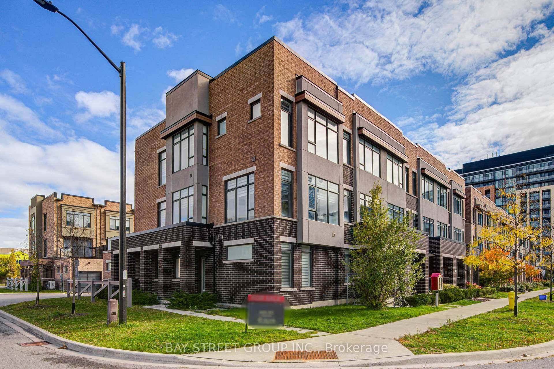 This stunning modern townhome, a sun filled corner unit in the heart of Maple, boasts an exceptional open concept layout.