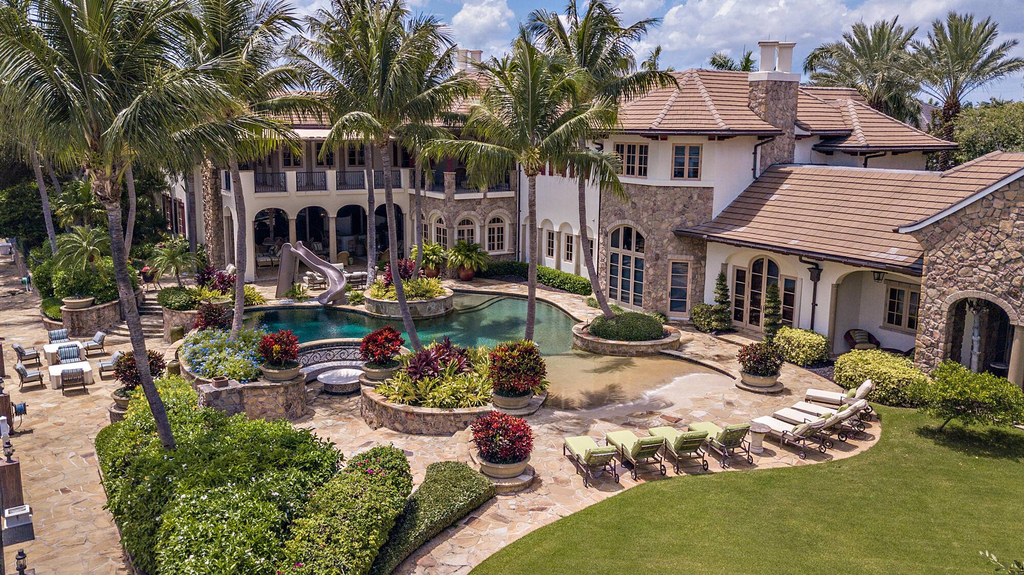 This unprecedented 25 room mansion sits on over one acre with 300 feet of water frontage.