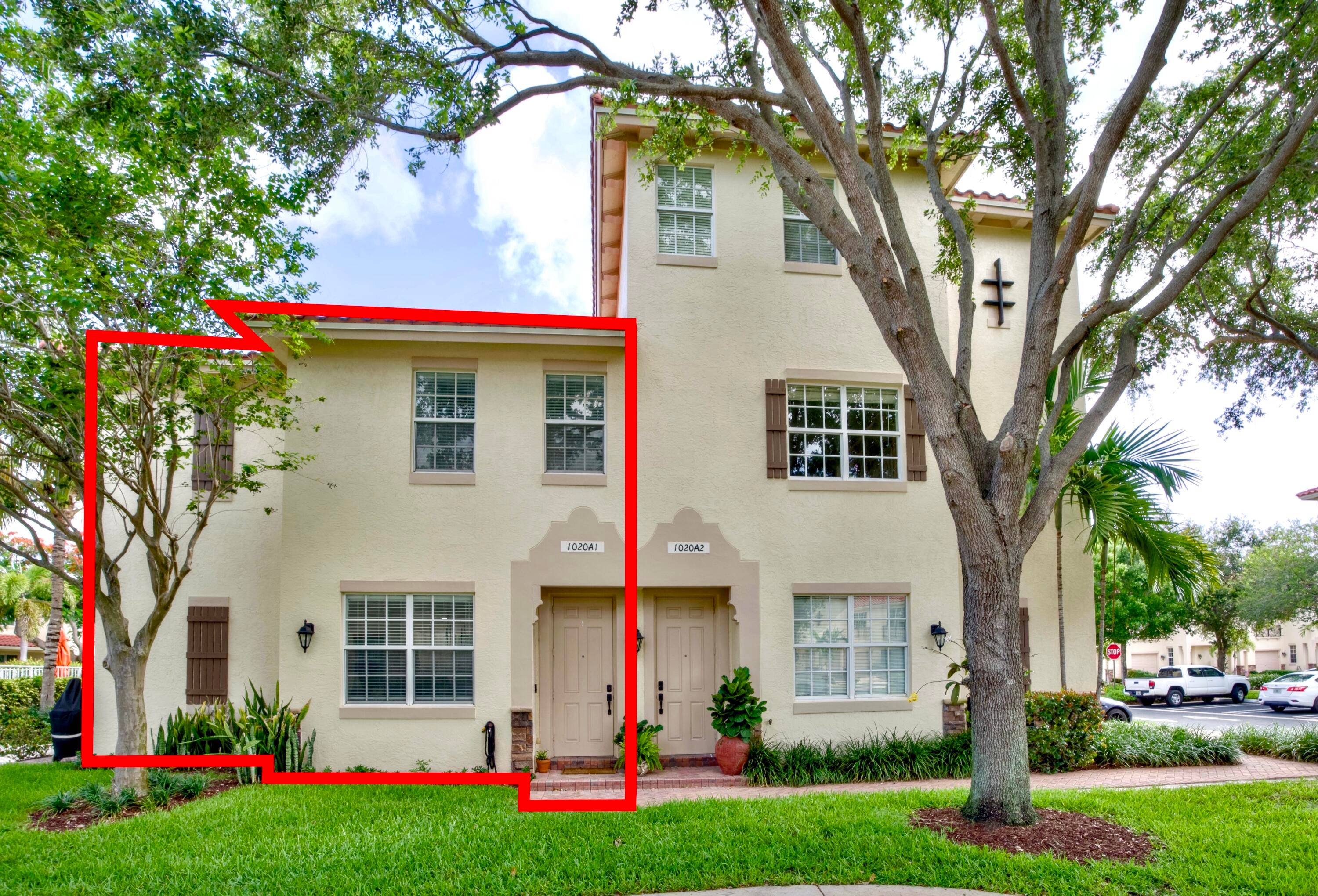 Updated corner unit townhome with 2024 roof, full impact windows, and walkable Delray Beach location.