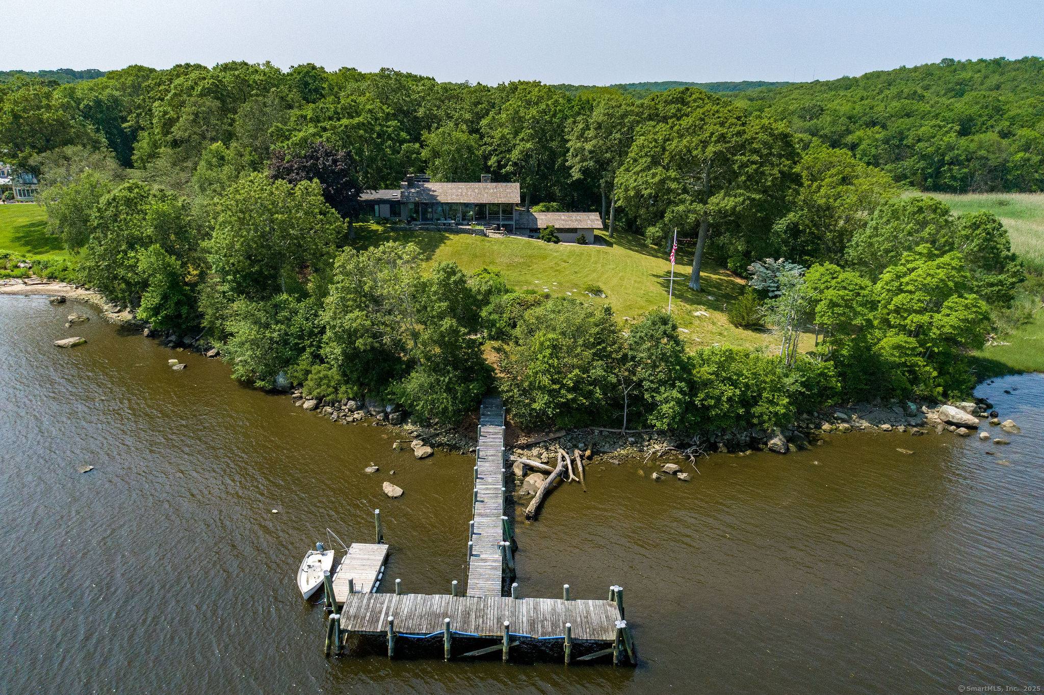 Presenting a single level light filled mid century modern masterpiece, set on a prominent 2.