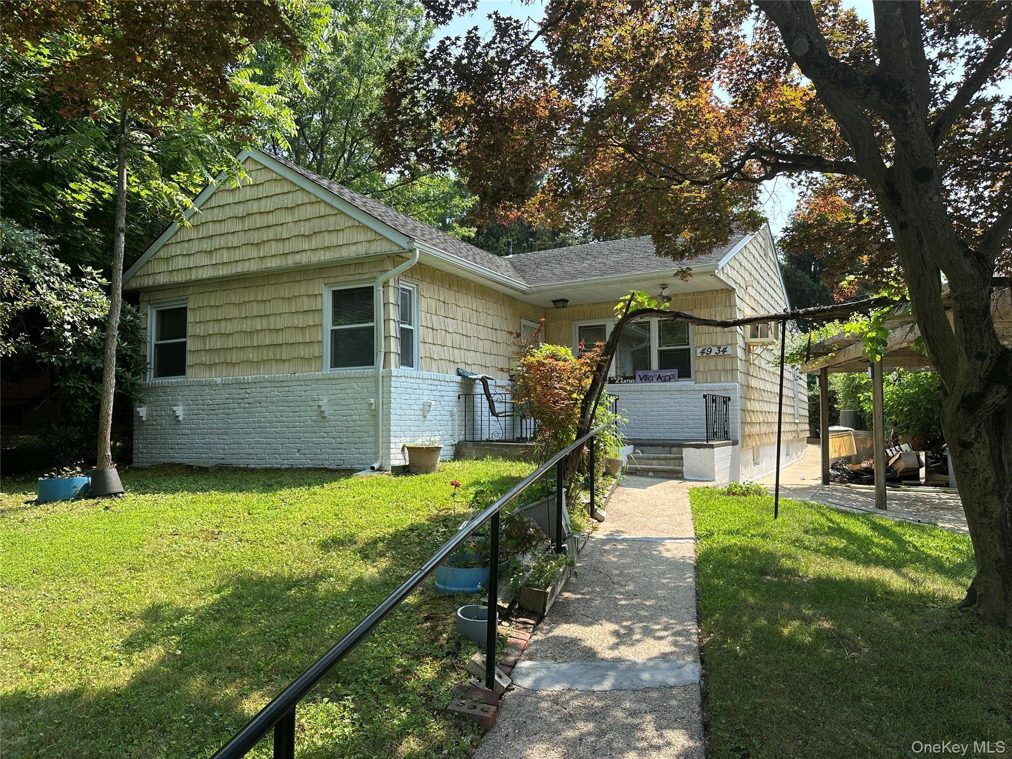 An open floor plan, set back on a hill, with a full finished basement with a bath and laundry room, quiet deck off the family room has great potential !