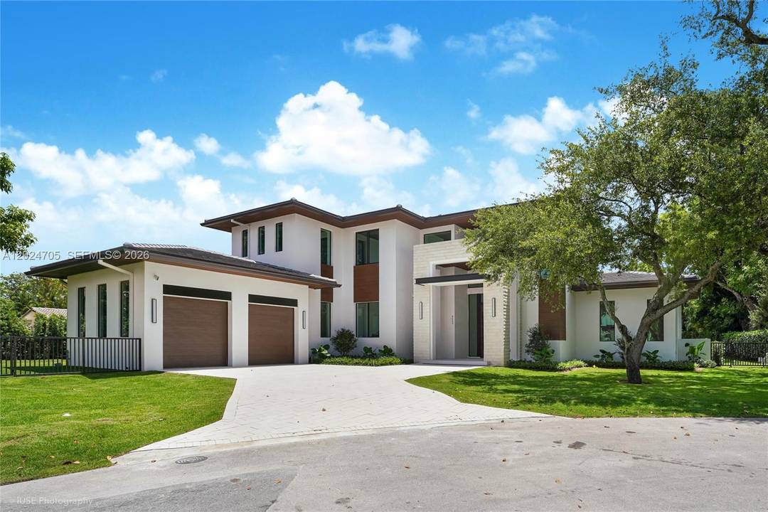 Tucked away at the end of a quiet cul de sac in the exclusive Coconut Palm Estates in North Pinecrest, this brand new 6br 5.