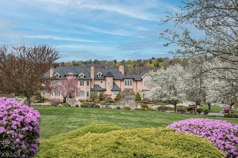 A grandly designed architectural masterpiece is surrounded by nearly 17 acres of natural beauty in Mendham Borough.
