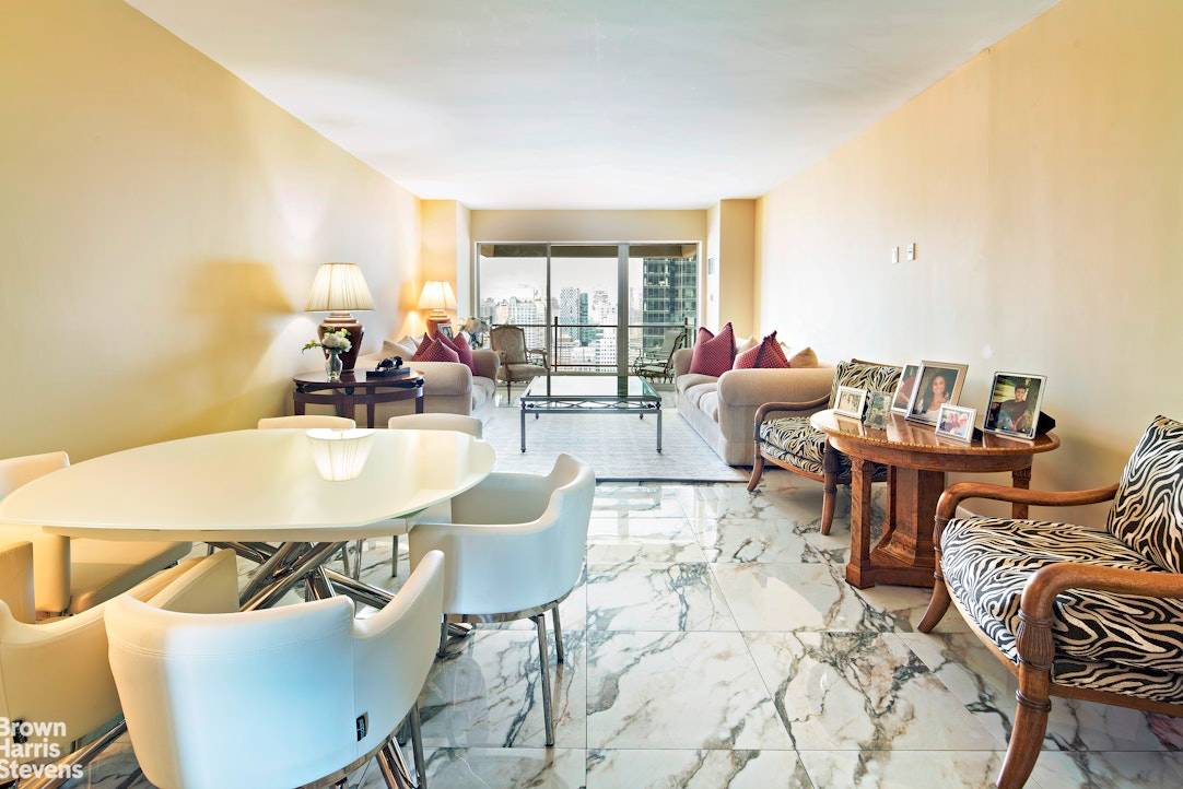 Enter this magnificent, light filled home through a marble gallery with a north facing living room and balcony and a south facing formal dining room with views of the city ...