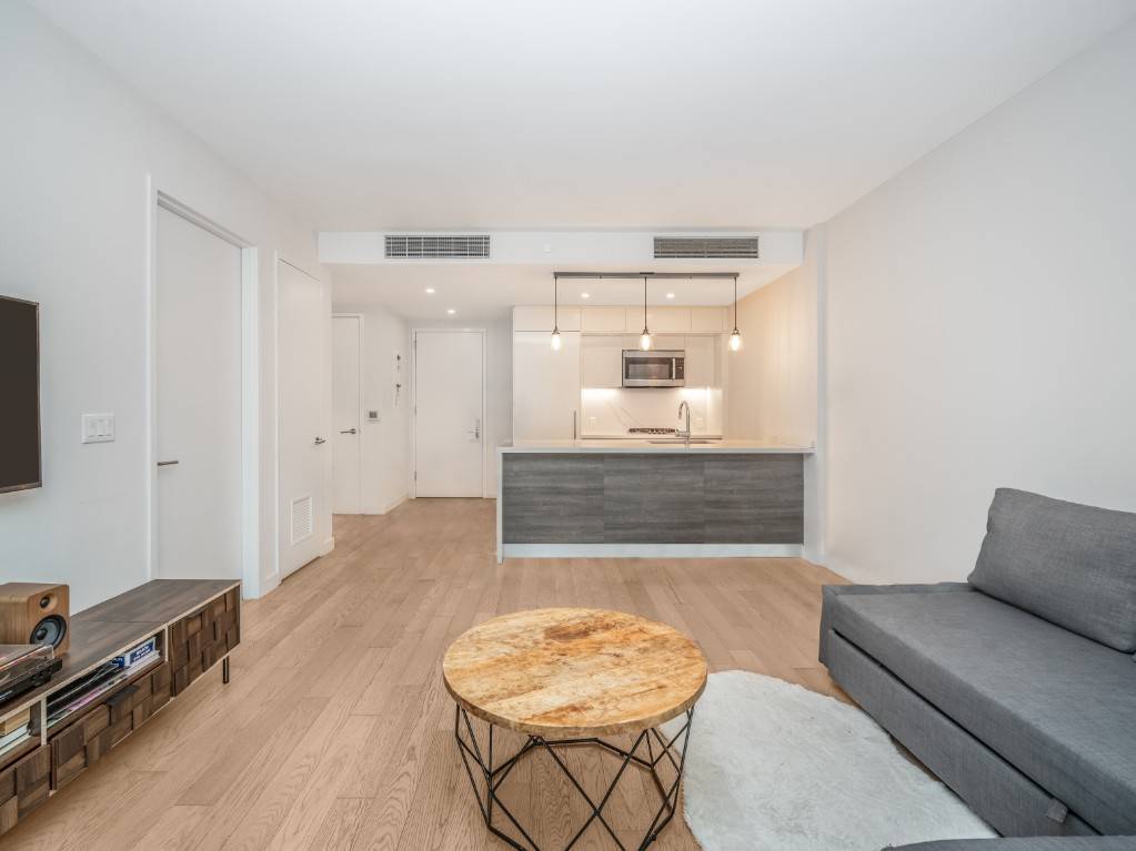 Luxurious one bedroom at the Charlie West condominium, thoughtfully situated facing the building's private and quiet landscaped interior garden.