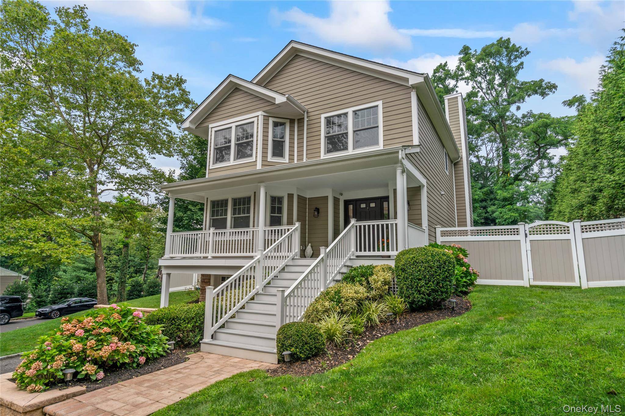 This beautiful young Colonial home, built in 2014, blends timeless charm with modern comfort.