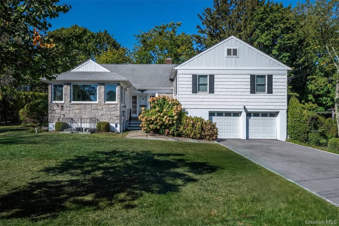 Welcome to 18 Lomond Place, a beautifully maintained and thoughtfully updated 4 bedroom, 3 bath family home tucked on a quiet, pretty block in New Rochelle.