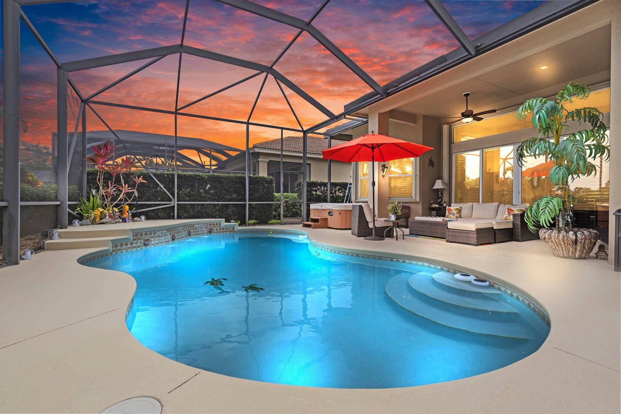 Stunning lakefront 3BR 3BA pool home with den in sought after PGA Village !