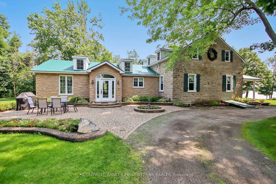 This extraordinary stone home sits on a breathtaking 13.
